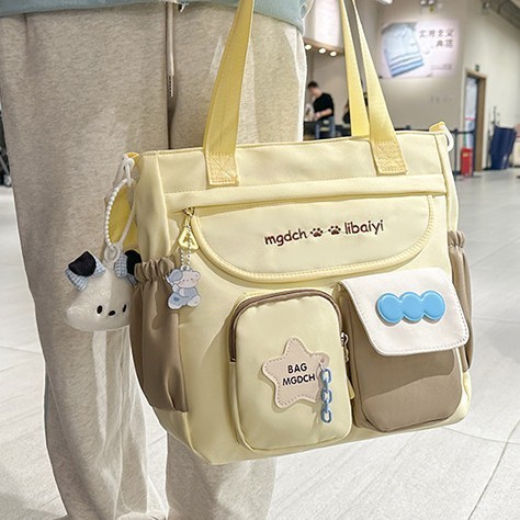 The new schoolbag for women is a large-capacity crossbody bag with a contrasting color for students. It is versatile, reduces the burden, and is fashionable and trendy with a cartoon single-shoulder design Application Scenario