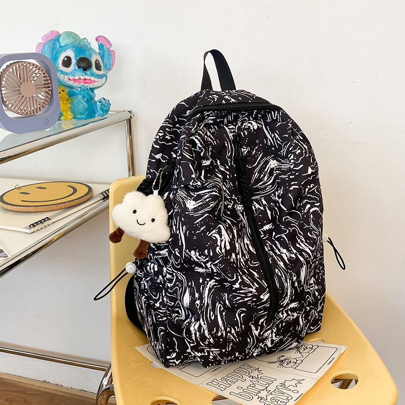Graffiti high appearance level schoolbag, girls' junior high school backpack, high school and college students' campus ultra-light new simple backpack Application Scenario