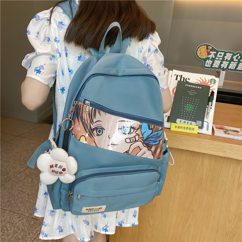 A new Korean version of a backpack for girls, featuring cartoon and anime nylon, is a trendy and casual schoolbag for junior high school students full figure