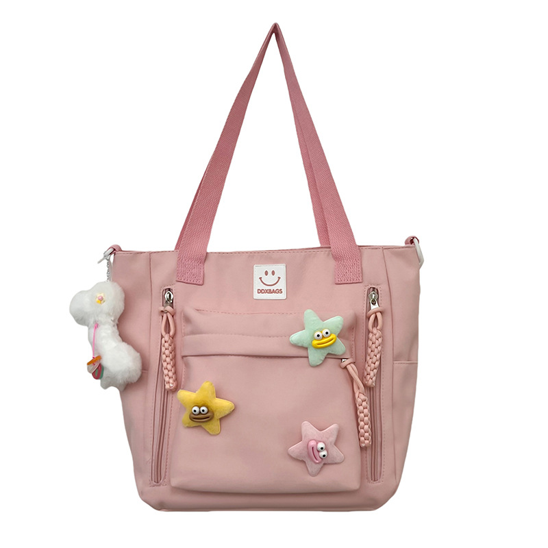 A versatile and casual fabric bag with a star-shaped design, lightweight and waterproof single-shoulder bag, and a crossbody bag for classes and shopping Item Picture