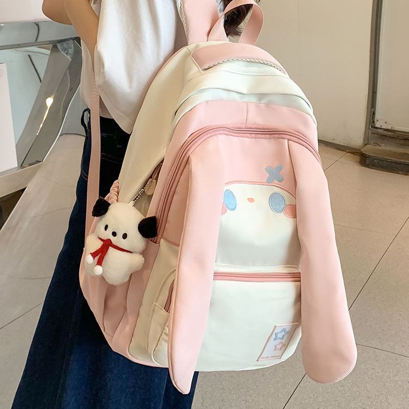 Big Eared Dog schoolbag for girls in grades three to six of primary school, large capacity, cute backpack for junior high school girls, children's backpack full figure