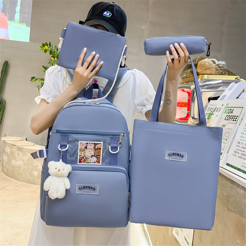 Wholesale of a new Japanese-style schoolbag with a cute and versatile campus style, a trendy four-piece backpack for primary school students full figure