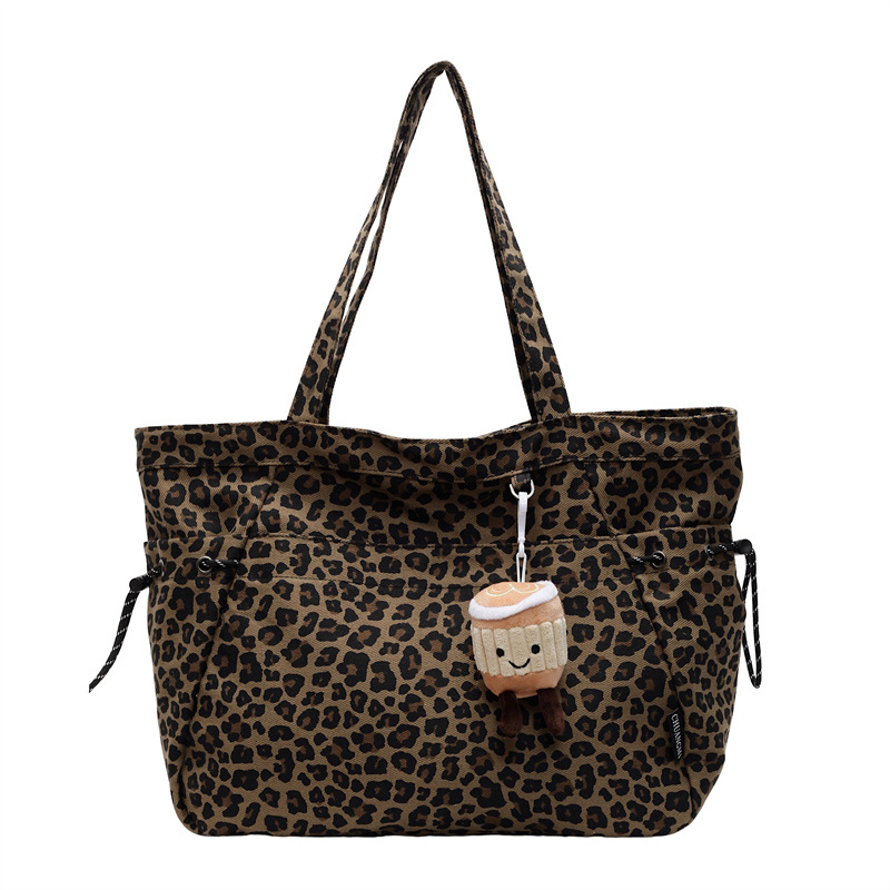 A niche leopard print canvas tote bag for women, a casual large-capacity fashionable hand-held bag, and a simple single-shoulder crossbody bag in the Korean style Item Picture