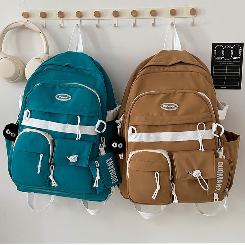 Japanese-style simple solid-color casual backpack, high appearance level, junior high school student schoolbag, large capacity, versatile, workwear-style backpack details Picture