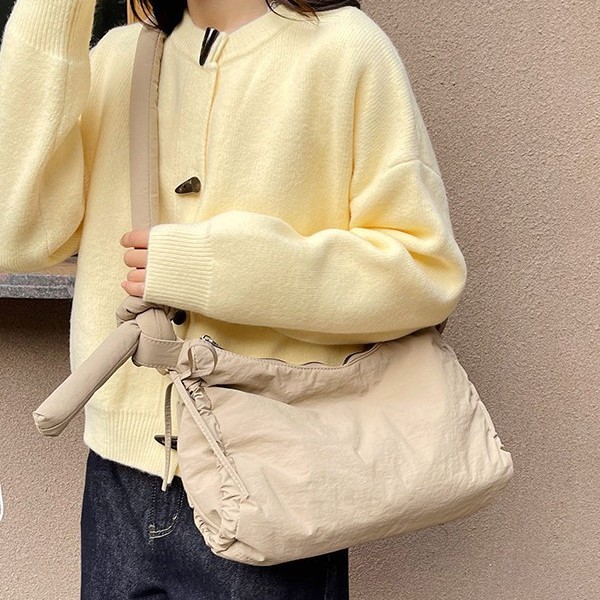 Outdoor sports style large-capacity nylon single-shoulder crossbody bag, retro tie handbag, women's casual solid color underarm bag Application Scenario