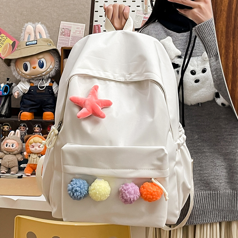 Minimalist style backpack, light and casual commuting style, trendy minimalist backpack, cute pom-pom girl style backpack Application Scenario