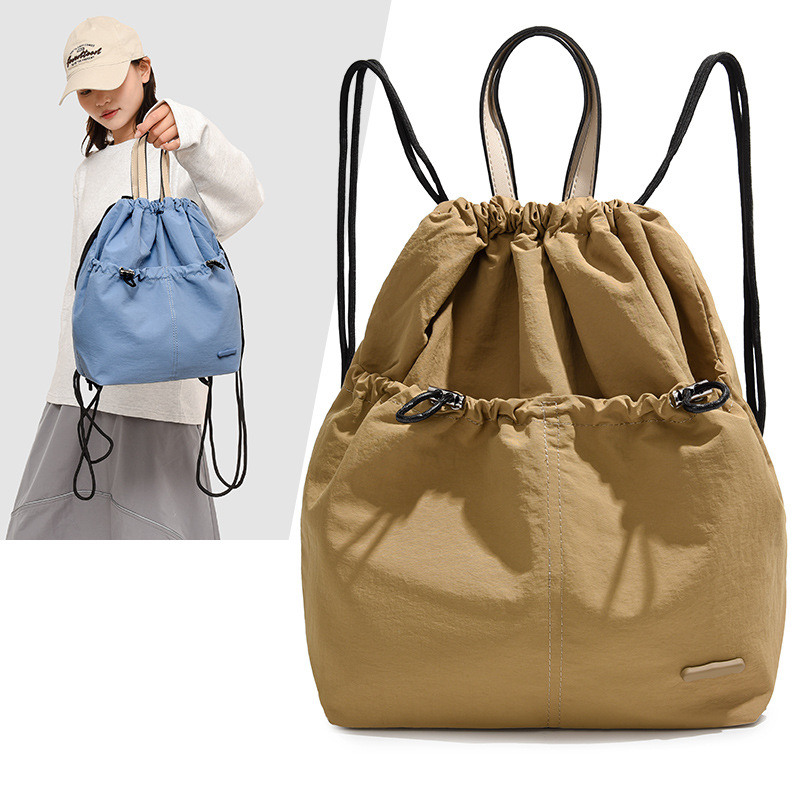 A new 2024 fashionable student backpack for women, a casual Korean-style backpack with drawstring pockets, and a travel bag full figure