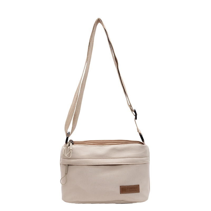 A simple solid-color nylon fabric bag for women, a new 2024 multi-functional casual, waterproof, portable and fashionable single-shoulder crossbody bag Item Picture