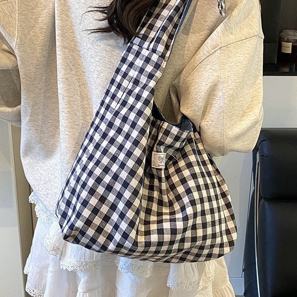 The new American denim double-sided backpack is versatile, with a large capacity checkered bag, a simple solid color tote bag, and a casual commuting bag full figure