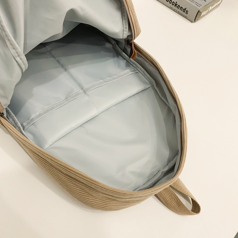A Japanese-style Harajuku Instagram backpack for junior high school students, solid color corduroy, artistic style, and a couple backpack for college students Application Scenario