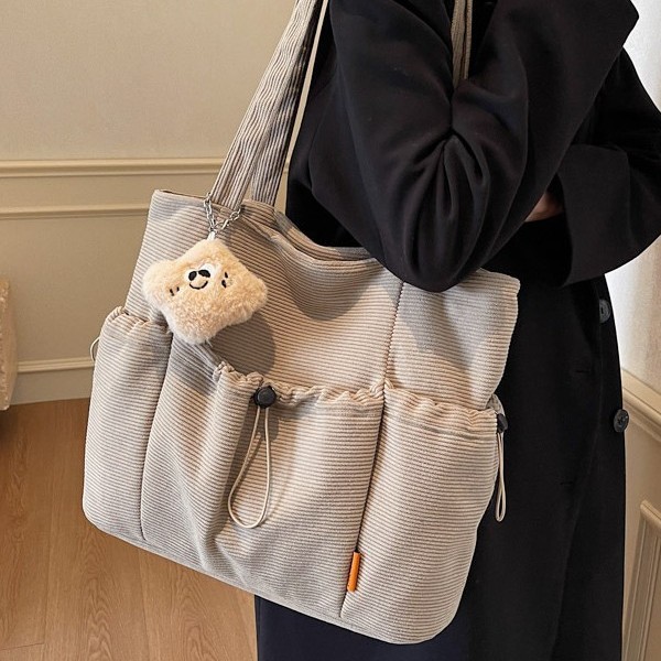 Multi-pocket tote bag, single-shoulder bag, Korean-style sports shoulder bag, simple, niche and fashionable, Japanese-style solid-color tote bag full figure