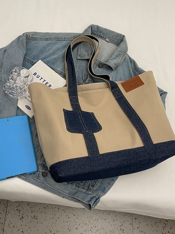 A new large-capacity tote bag for women, a color-blocking canvas bag, a casual and simple hand-held shoulder bag, and a fashionable underarm bag Item Picture