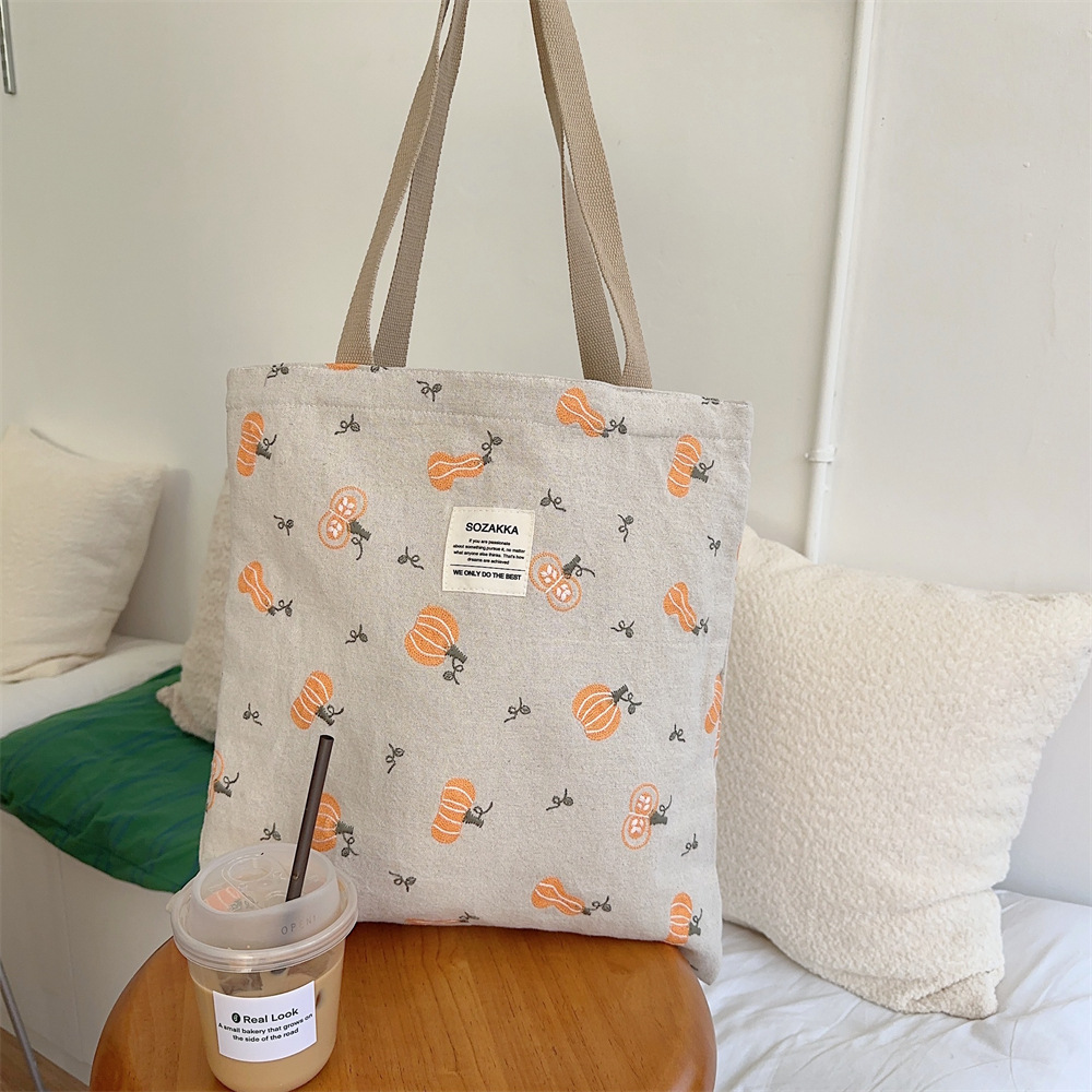 43204 Pumpkin embroidered canvas bag for women, Instagram Korean-style college student schoolbag, single-shoulder hand-carried bag Item Picture