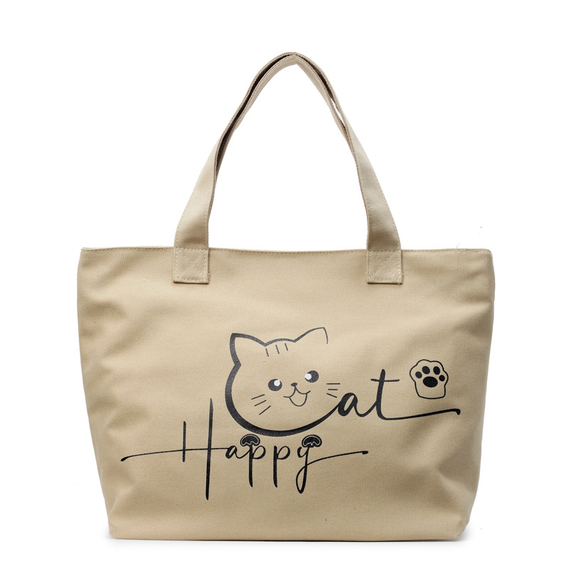 Cute cat-printed large-capacity, simple and fashionable schoolbag, fashionable and individual hand-held shoulder new class bag Item Picture