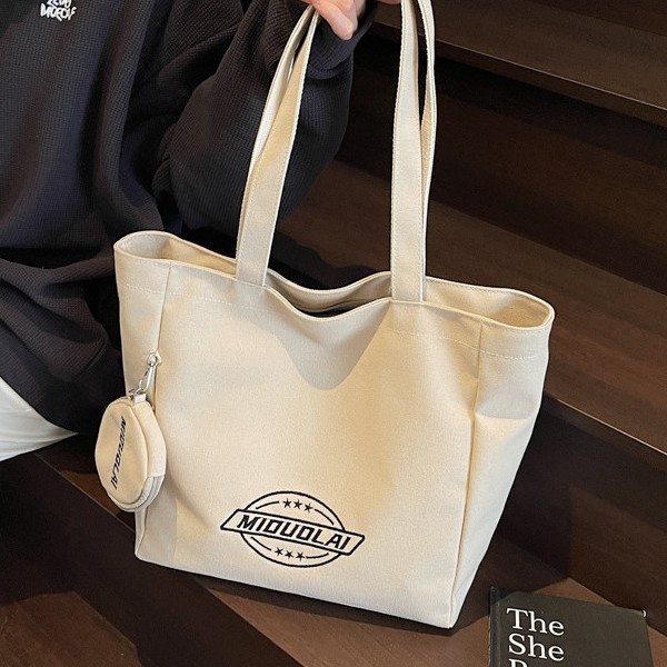 New embroidered canvas bag, versatile, thickened single-shoulder, large capacity, simple student commuting, hand-held tote bag for class, trendy Application Scenario