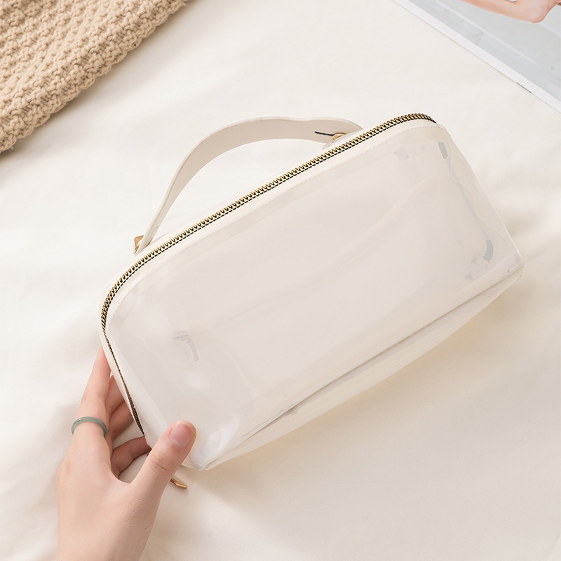 Waterproof PVC hand-held makeup bag, multi-functional large-capacity shell makeup bag, high appearance level portable washbasin storage bag Specification drawing