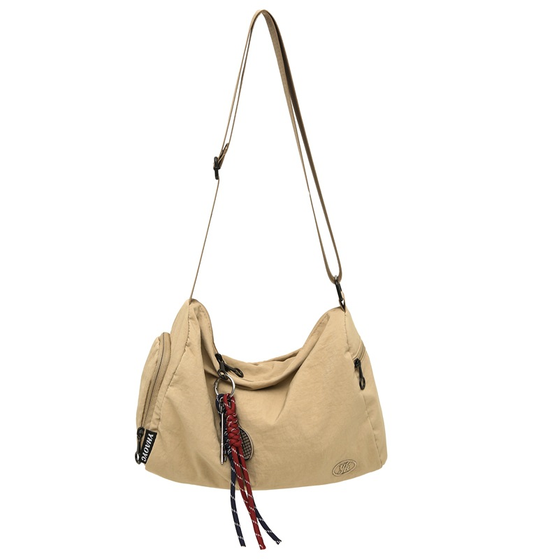A trendy new lightweight single-shoulder crossbody bag for both men and women, a Japanese-style commuter casual couple bag, and a sports student bag Item Picture