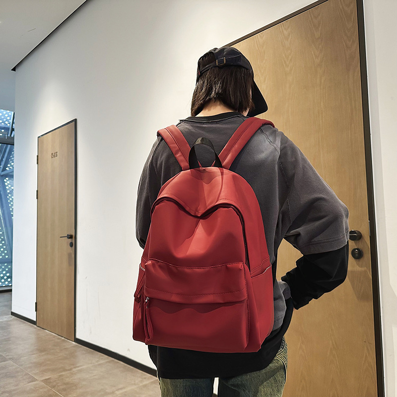 Solid-color schoolbags for female students, casual college students, simple and fashionable travel bags, trendy brand, large-capacity backpacks for men details Picture