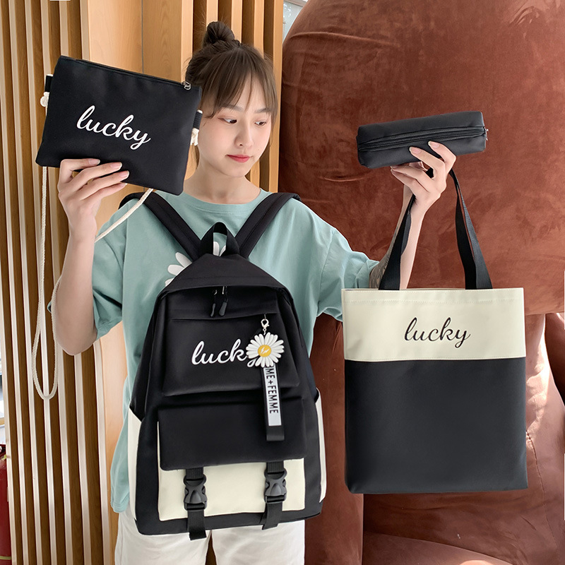 Wholesale of four-piece sets for junior and senior high school students, including new Korean version backpacks for girls with contrasting letters and colors full figure