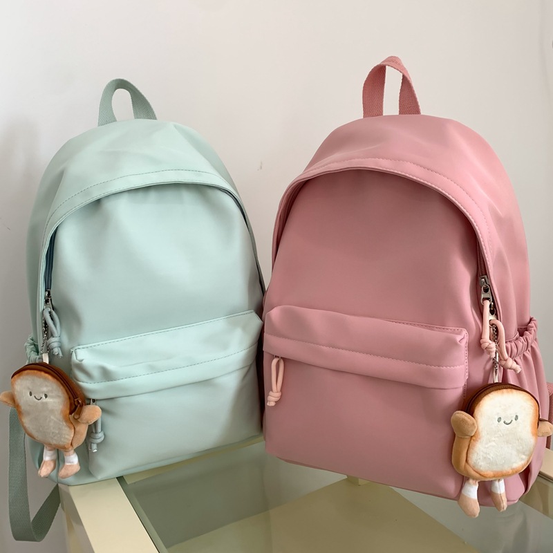 Cross-border Japanese-style campus casual solid-color schoolbag, simple large-capacity lightweight backpack, junior high school and primary school students' backpack Application Scenario