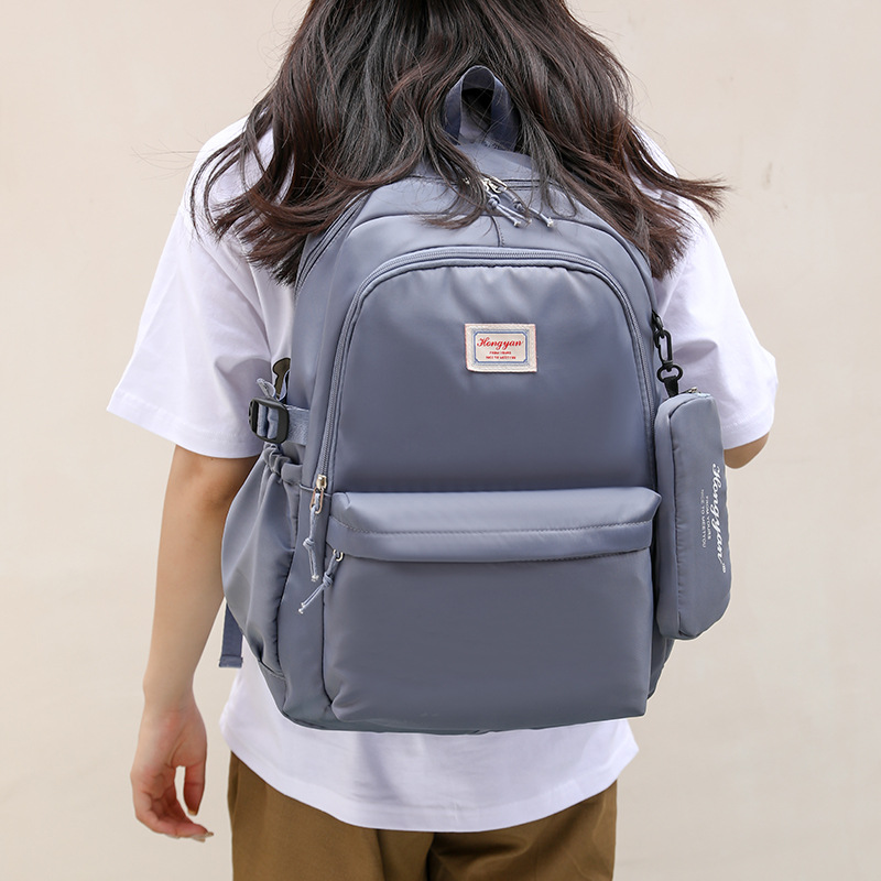 Wholesale of new Korean-style casual large-capacity backpacks for foreign trade students, including school bags for junior and senior high schools and outdoor travel bags details Picture