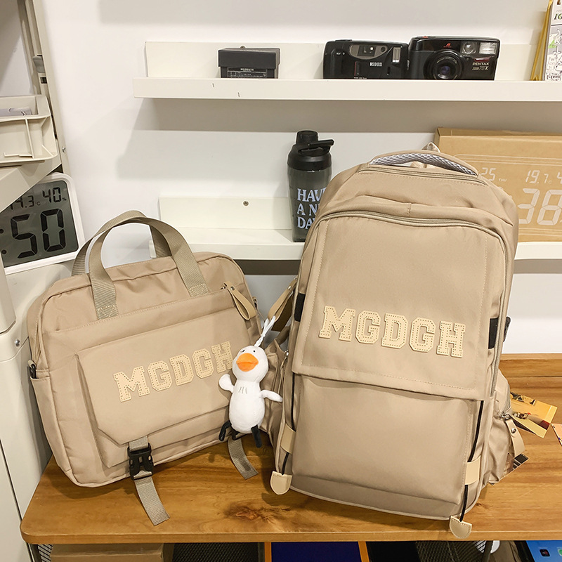 New Korean version large-capacity backpacks with letters for both men and women are available in spring. This two-piece set is a versatile backpack for junior and senior high school students Application Scenario