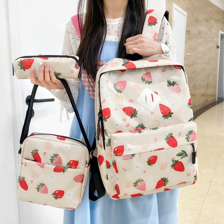 A new Korean-style versatile casual bag with a large capacity. It is a strawberry print backpack for primary, middle and high school students with a high level of appearance details Picture
