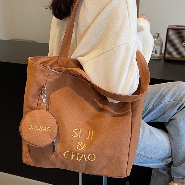 Large-capacity class single-shoulder commuting versatile bag, tutorial bag, hand-held canvas bag, student tutorial and work commuting bag details Picture