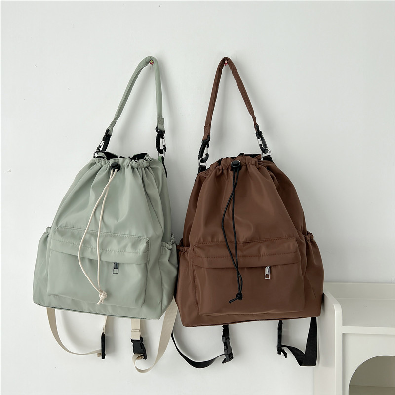 Single-shoulder crossbody bag 2025, fashionable and casual bucket bag, new Korean version, double-shoulder women's bag, large capacity hand-held drawstring bag details Picture