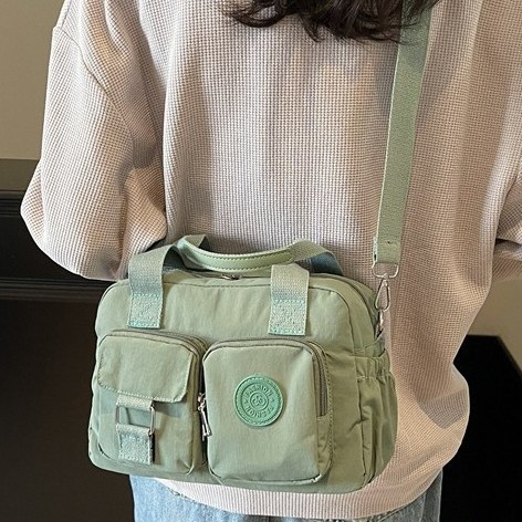 Spring/Summer New 2025 Fashionable, versatile, casual and simple nylon fabric hand-held multi-pocket workwear-style single-shoulder crossbody bag Application Scenario