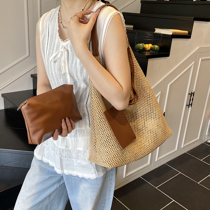2025 New summer fashion women's hand-held woven bag, fashionable and stylish women's seaside and beach vacation straw woven single-shoulder bag details Picture