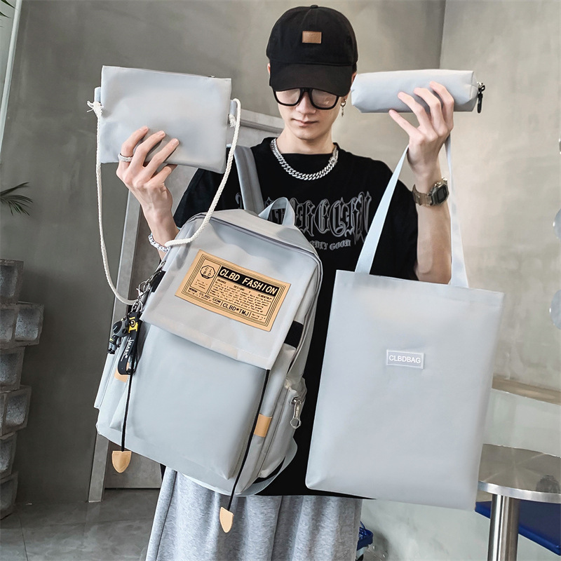 2024 New style of student schoolbag, a fresh and clean college style four-piece set for both boys and girls, a simple and large-capacity backpack Application Scenario