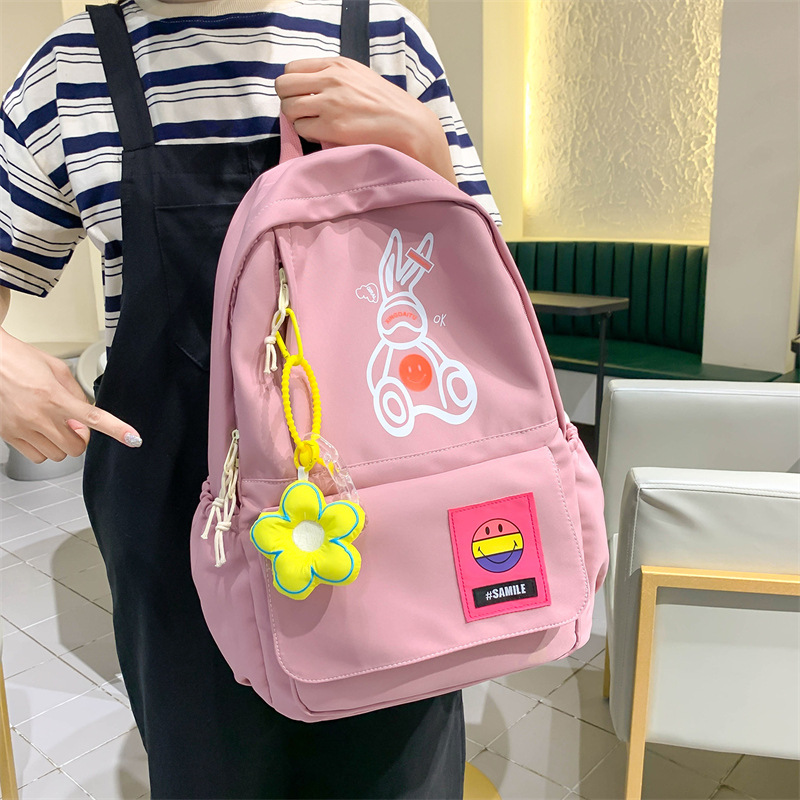 Wholesale of new cute cartoon schoolbags for middle school students, Korean version of simple schoolbags for college birthdays full figure