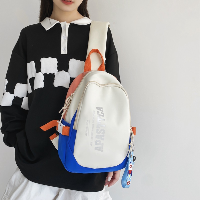 Japanese color-blocking crossbody bag for female students, sports chest bag for women, large-capacity casual trendy brand canvas single-shoulder backpack for men Application Scenario