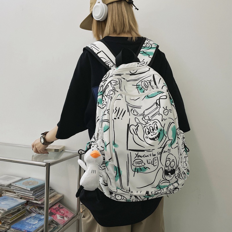 Fashionable graffiti printed schoolbag for girls, cool and trendy ins Japanese Harajuku style backpack, simple college student high school backpack details Picture