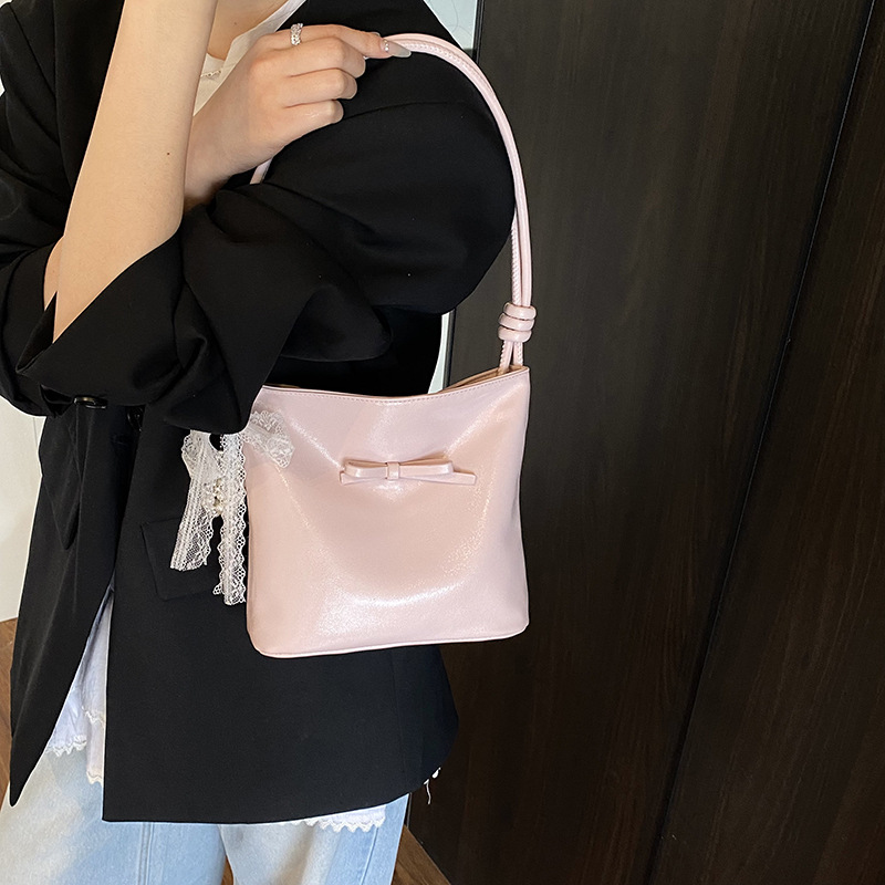 Korean style fashion niche bow hand-held bucket bag for women 2025 new summer, high-end and versatile single-shoulder underarm bag details Picture