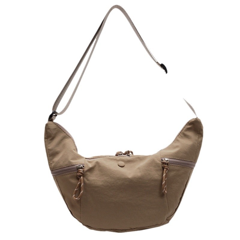 Simple, niche and versatile solid color washable fabric horn bag for women's travel, light and versatile, commuting and casual single-shoulder crossbody bag Item Picture
