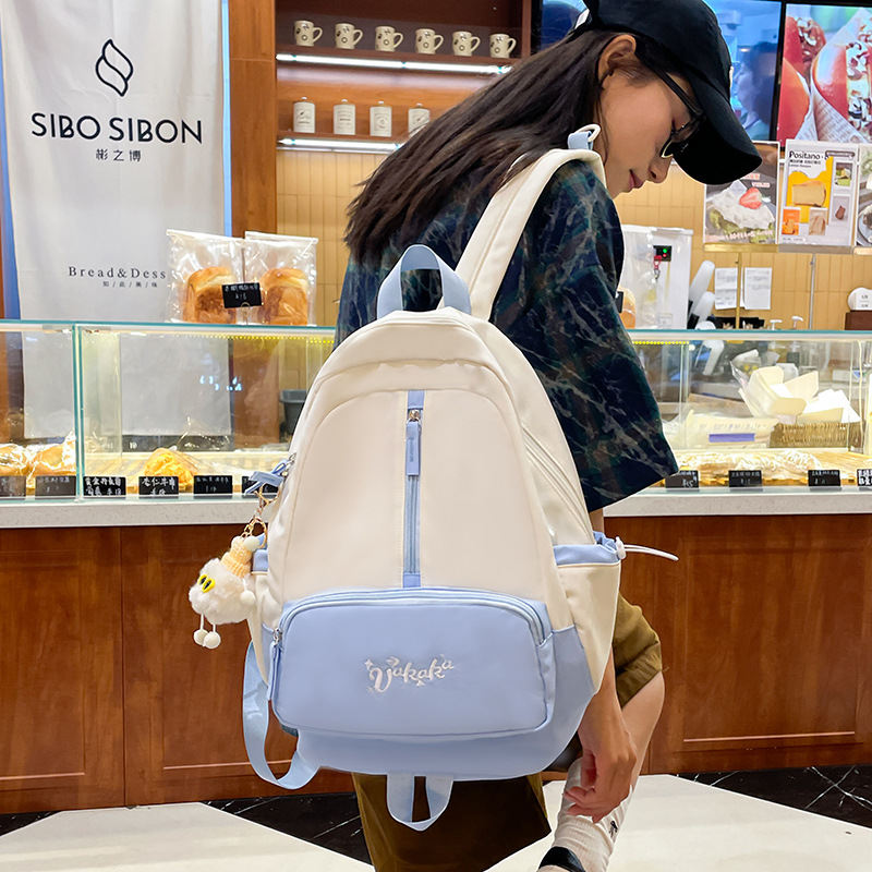 A female college student's Instagram-style forest-themed backpack with a high level of appearance and a soft girl. It features a color-blocking and versatile large-capacity campus backpack details Picture