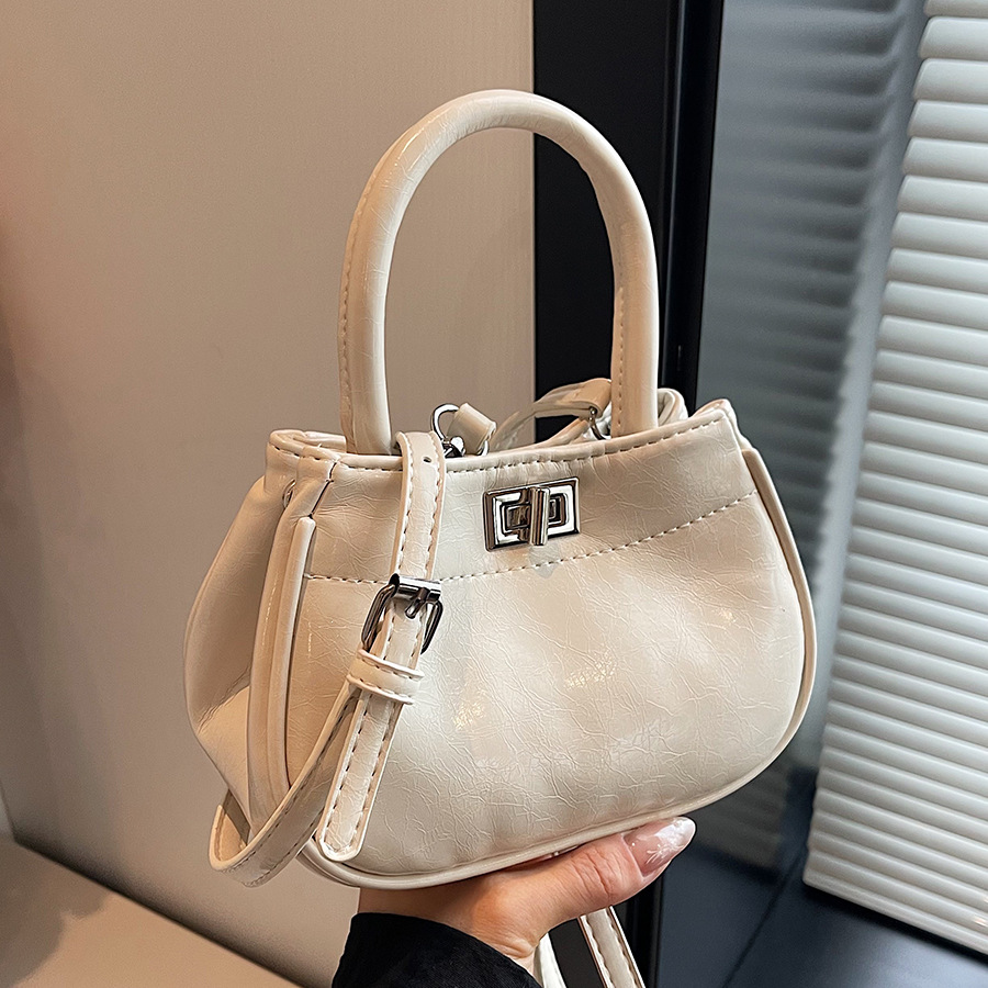 High-end hand-held bucket bag for women 2024 new style, fashionable, simple and versatile single-shoulder bag, niche design casual women's bag full figure