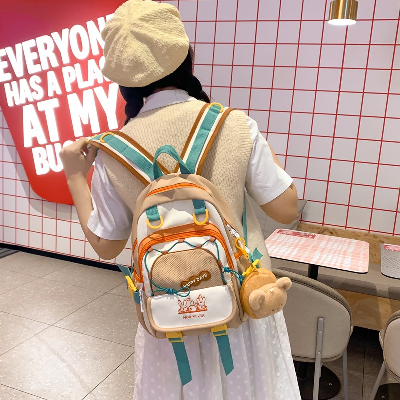 The new 2025 schoolbag with a school style and contrasting colors is a lightweight and mini backpack. It's a cute and fresh girl's backpack full figure