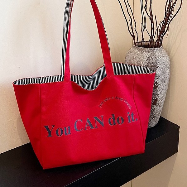 A new large-capacity tote double-sided striped casual single-shoulder textured lettered canvas bag for student commuting from South Korea details Picture