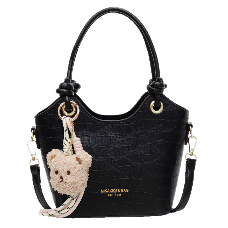 The new 2025 summer collection features a simple and stylish hand-held bucket bag with a unique design for women's fashion and versatility. It is a single-shoulder crossbody bag for commuting Item Picture