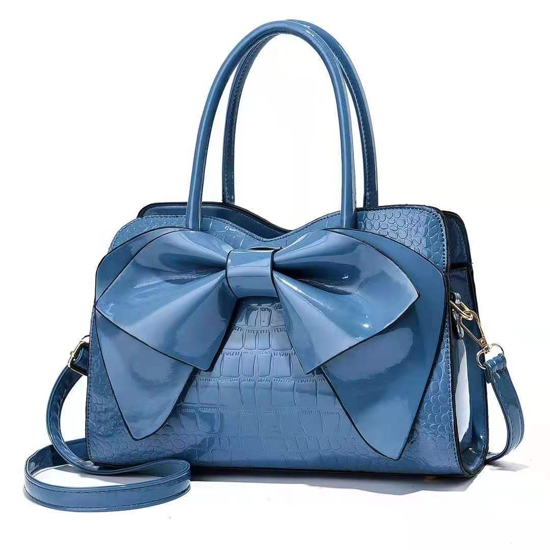 Cross-border foreign trade hand-held large bag 2022 New style fashionable crocodile pattern bow bucket bag patent leather shiny crossbody bag Specification drawing