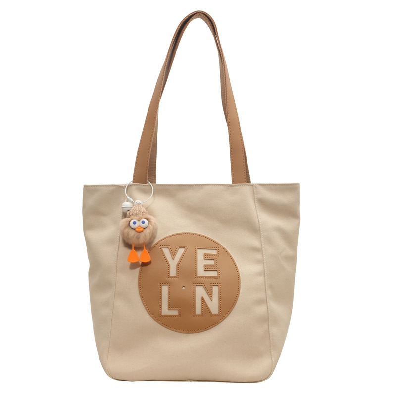 Large-capacity tote bag for women 2025, fashionable, casual and versatile canvas bag, niche hollowed-out high-end student single-shoulder bag Item Picture