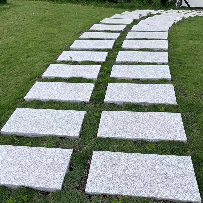 Granite flamed slabs, stepping stones, lawn footpads, paving stones, stair steps, treads, flower beds, fence top stones full figure