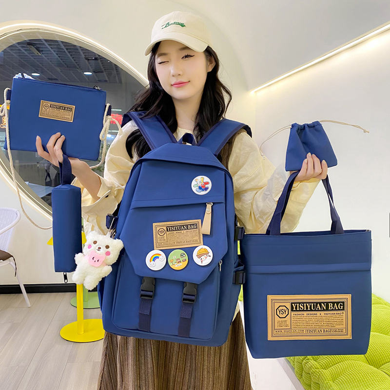 This year, simple solid-color school bags for junior and senior high school students, five-piece campus backpacks, and multi-functional tutorial backpacks are in fashion full figure
