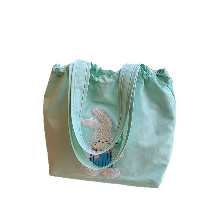 A simple and stylish soft-faced large-capacity bag for women, a new spring/Summer 2025 student class single-shoulder bag and commuter tote bag Item Picture