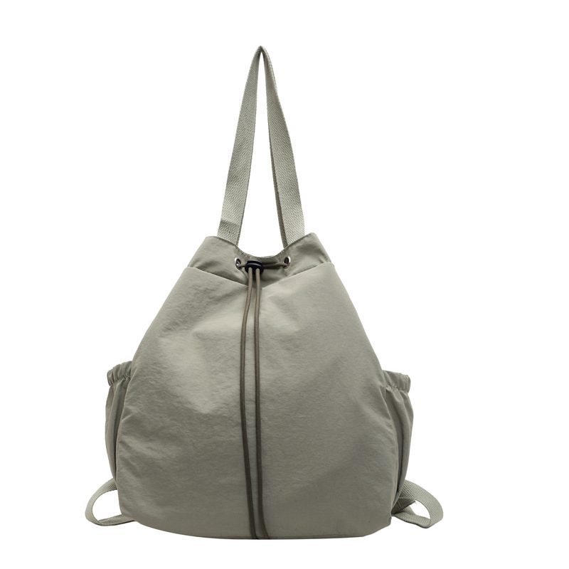 Backpacks for women's commuting, solid-color casual single-shoulder tote bags, large-capacity water-resistant nylon backpacks, a trend Item Picture