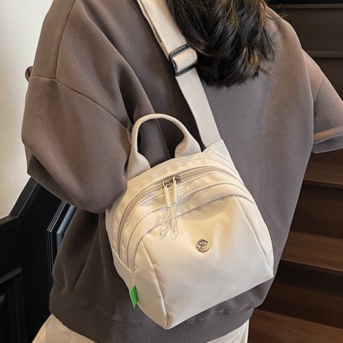 Backpack 2025 Spring/Summer New Women's bag, fashionable and casual nylon fabric bag, lightweight women's travel bag, solid color crossbody bag details Picture