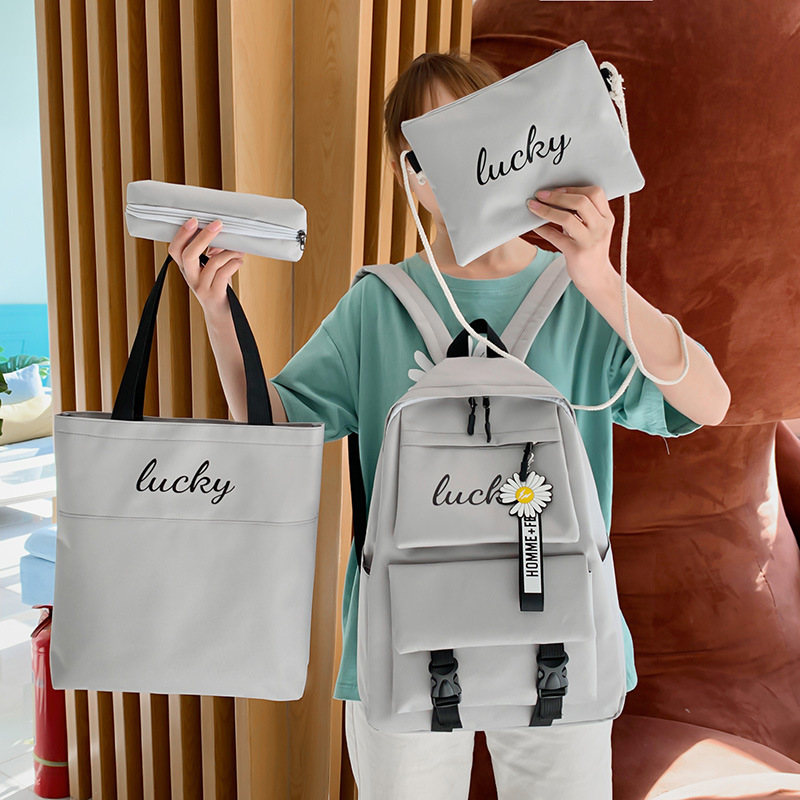 Wholesale of four-piece sets for junior and senior high school students, including new Korean version backpacks for girls with contrasting letters and colors Specification drawing